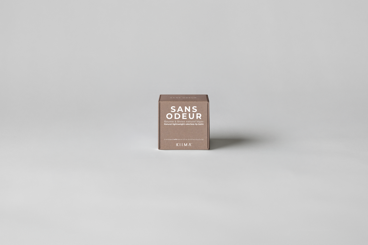 KIIMA Vanille Coco lightweight natural lip balm packaging on a gray background.