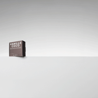 Animated reveal of KIIMA refillable lip balm and assorted cardboard refills like Vanille Coco and Melon d'Eau.