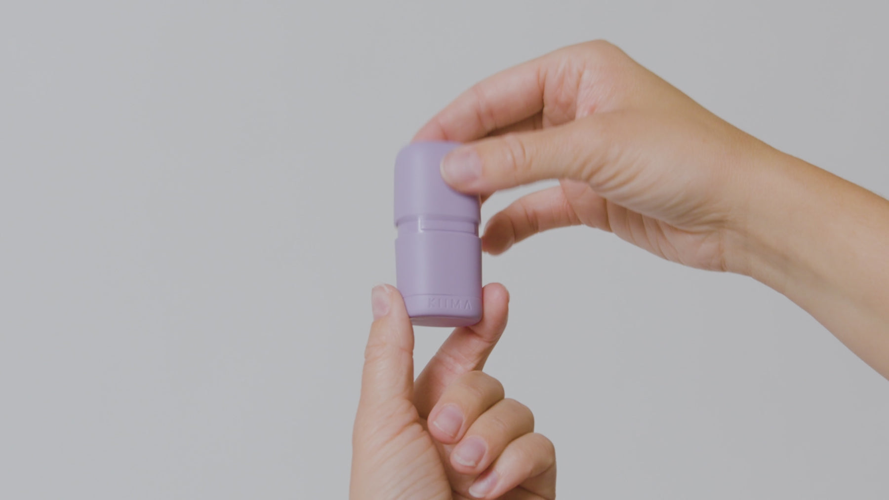 Step-by-step visual guide for the KIIMA lip balm: open the purple applicator, remove the internal clip, insert the natural lip balm refill, secure the clip, and rotate the base three times to use.